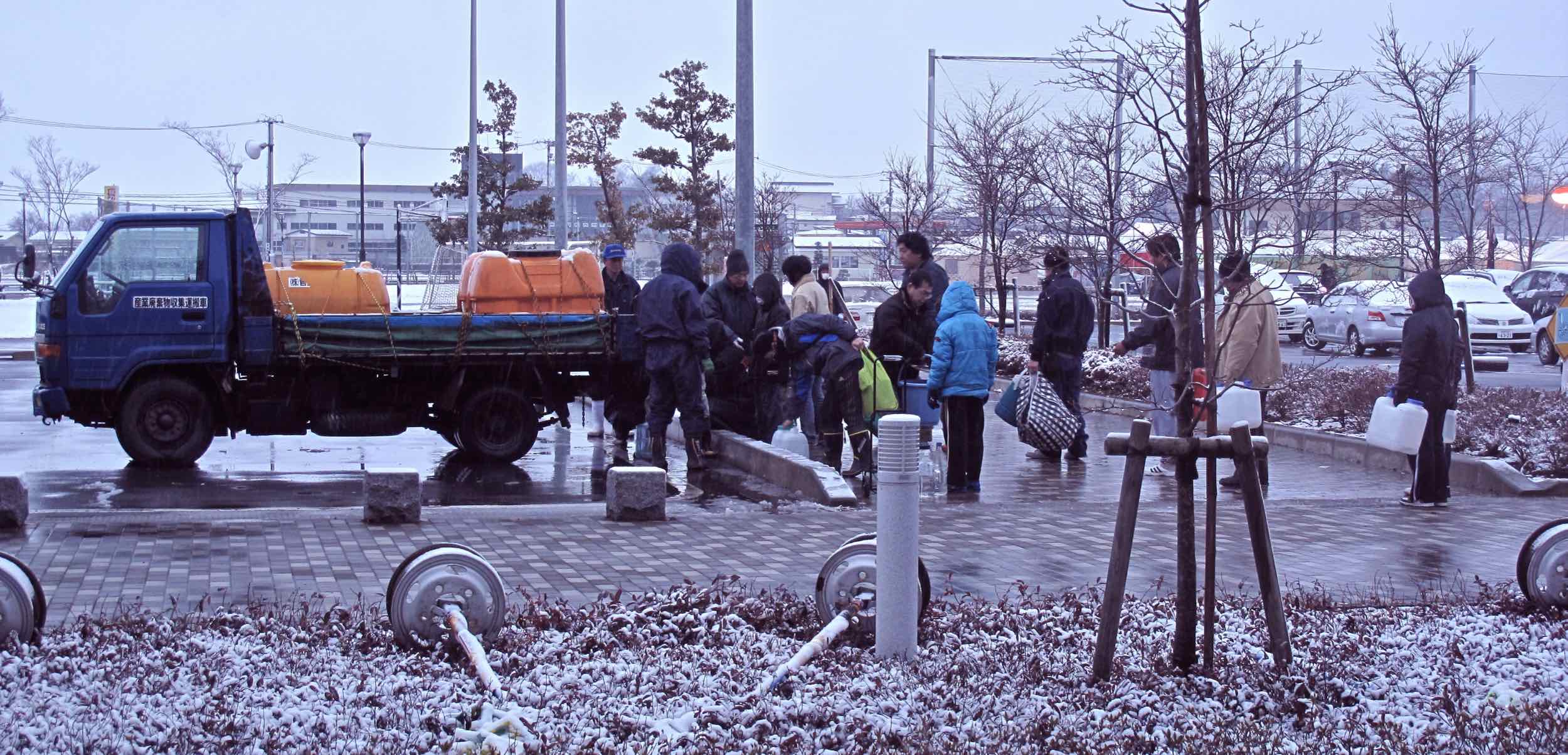  3/15 distributing drinking water in front of Tome City Hall 